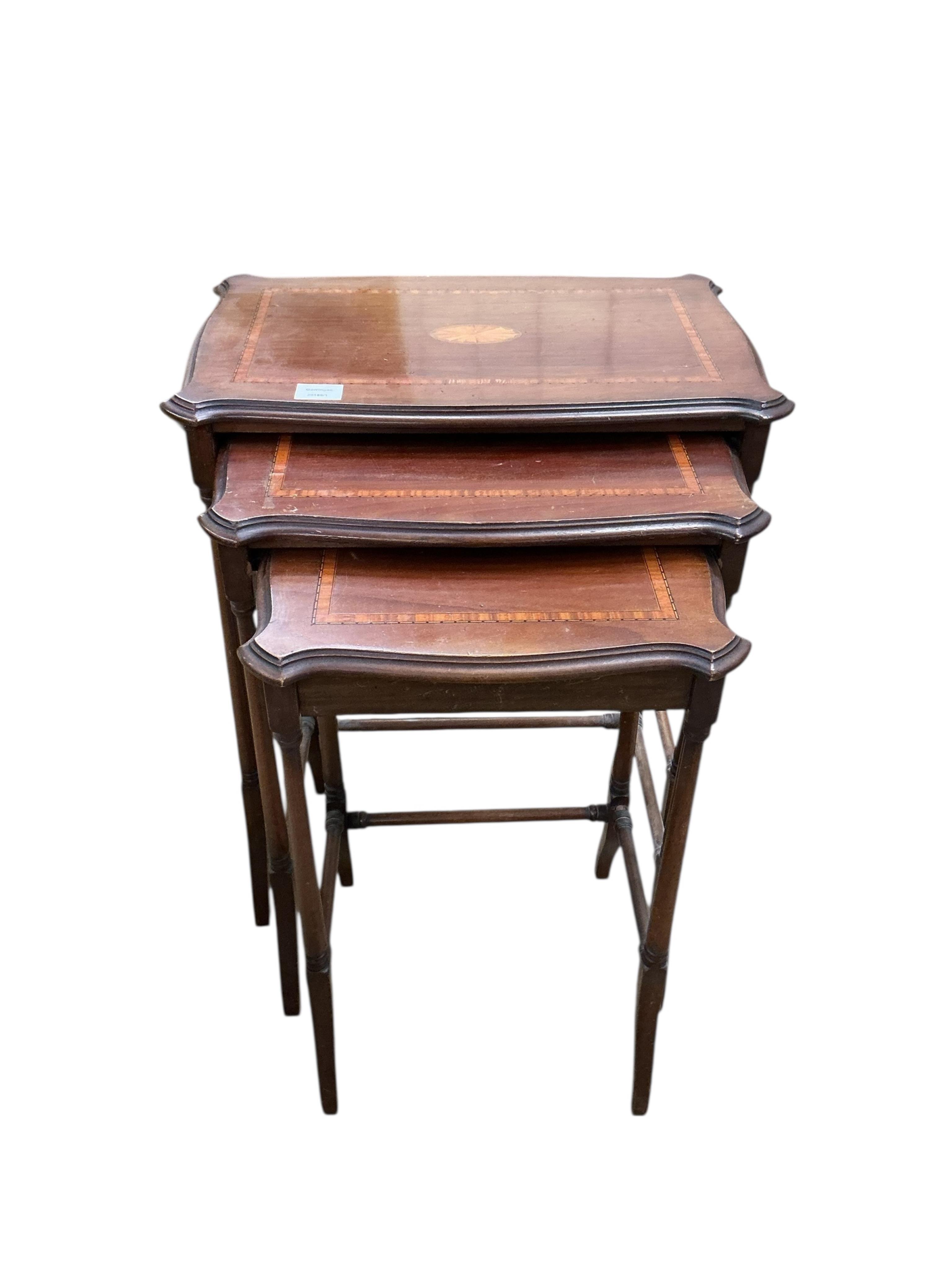A nest of three Edwardian satinwood banded and inlaid rectangular serpentine tables, width 56cm, depth 36cm, height 66cm